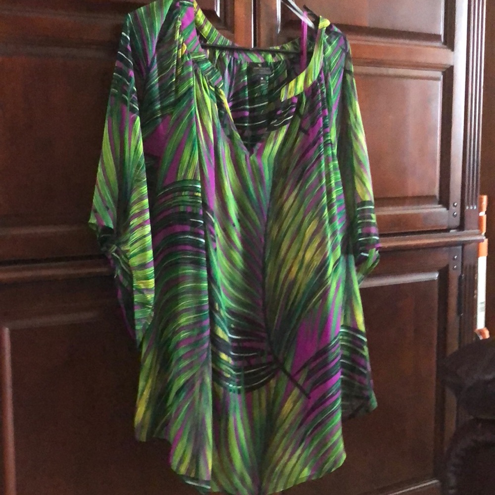 Blouse clear with an orchid top under.